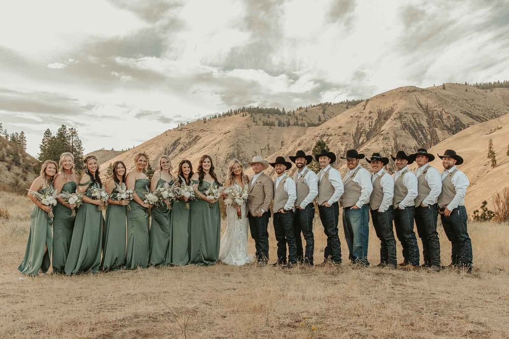 Bride and her bridesmaids in sage-green dresses candid moments at the American Homestead wedding venue. Spokane wedding photographer