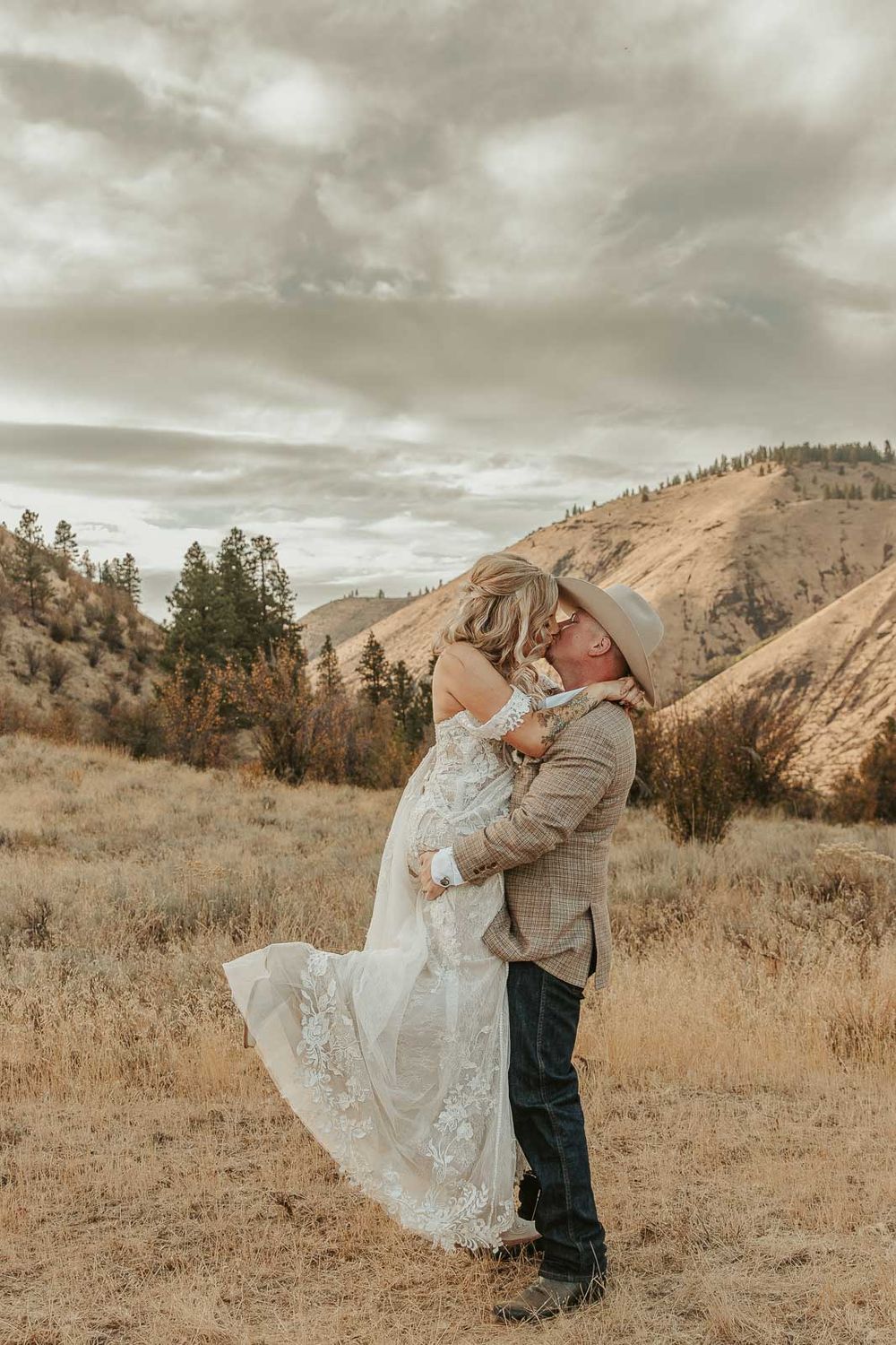 Bride and groom share a authentic candid moment surrounded by rustic beauty in Naches, WA. Photographed by a Washington wedding photographer