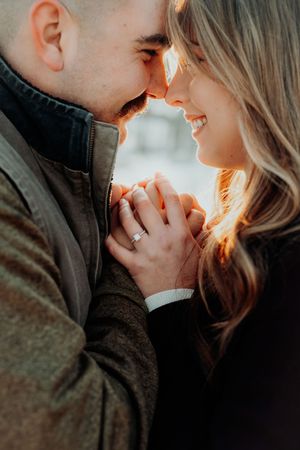 Romantic close-up photo series of couple sharing intimate moments in warm sunlight with golden glow.
