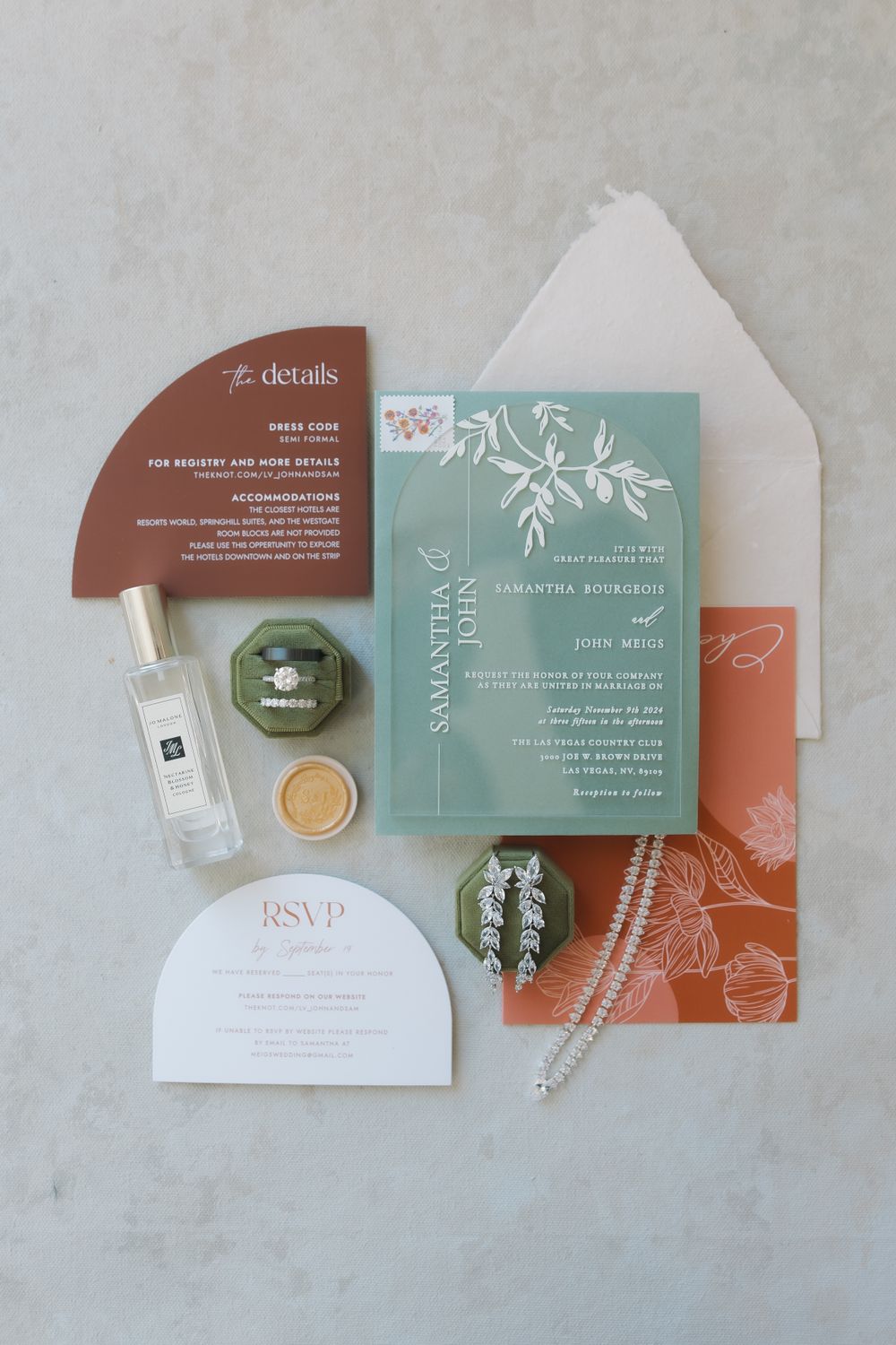 Modern wedding invitation suite in teal and terracotta colors with elegant typography and floral designs.