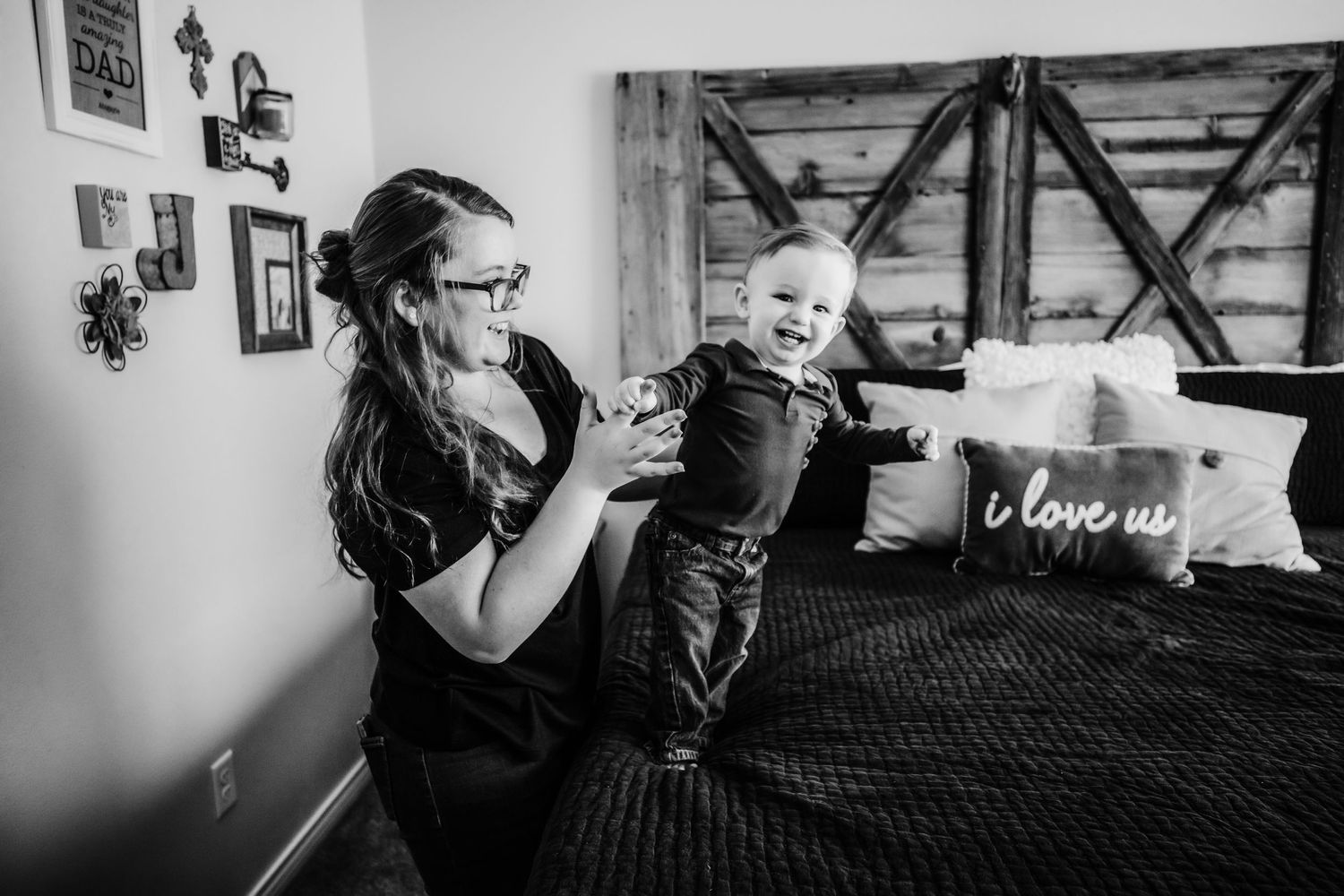 Big sister plays with her little brother during an in home family session in Dickson, TN