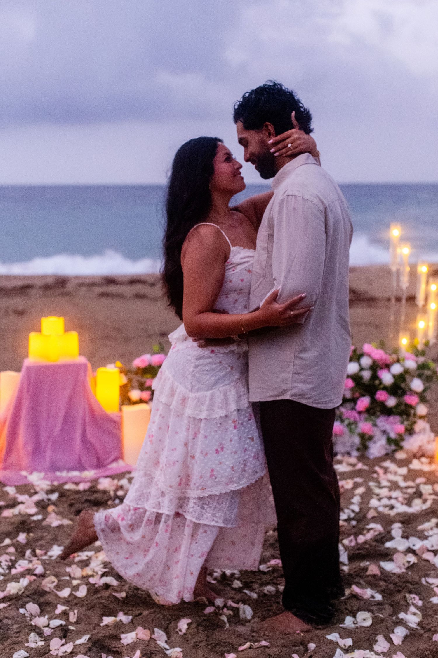 Marriage proposal on the beach with flowers and candles. Playa Guajataca, Isabela, Puerto Rico.
