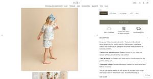 Young girl wearing a white embroidered short set with blue floral details, styled with a blue hair bow.