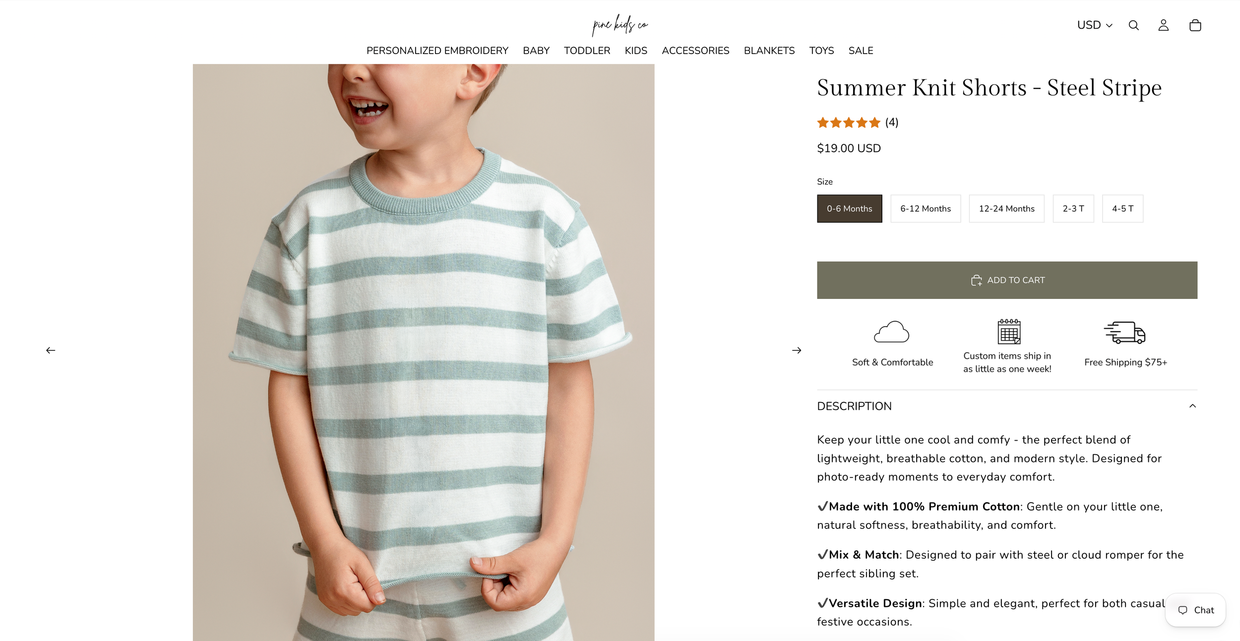 A young boy wearing sage green and white striped knit shorts and matching tee set on a clothing retail website.