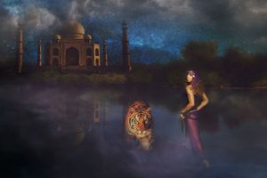Woman in purple stands by a misty lake with a tiger, with the Taj Mahal glowing beneath a starry night sky.