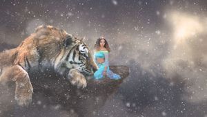 Fantasy composite of a woman in turquoise sitting on a floating rock beside a giant tiger in a snowy, cloudy sky.