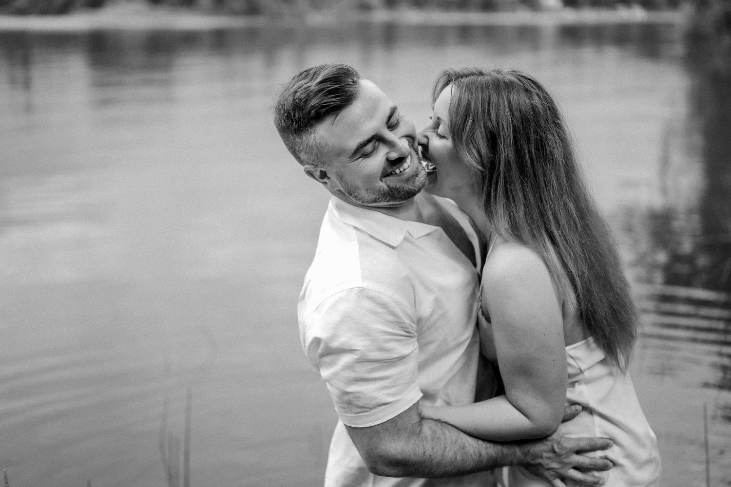 A heartwarming black and white outdoor family embrace.