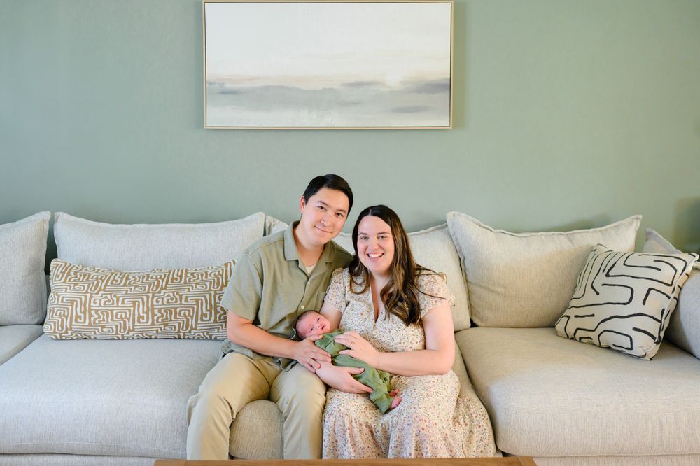 In-home newborn photography in Bedford, VA capturing authentic family moments in a relaxed environment.