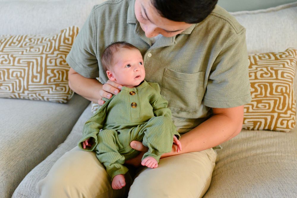 In-home newborn photography in Bedford, VA capturing authentic family moments in a relaxed environment.