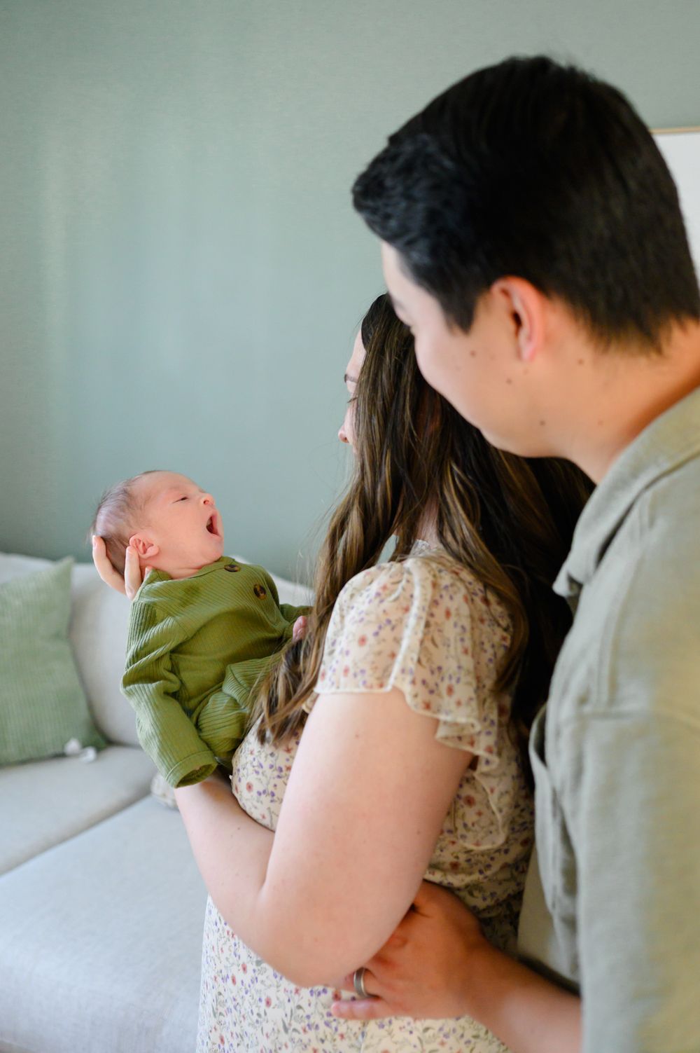 In-home newborn photography in Bedford, VA capturing authentic family moments in a relaxed environment.