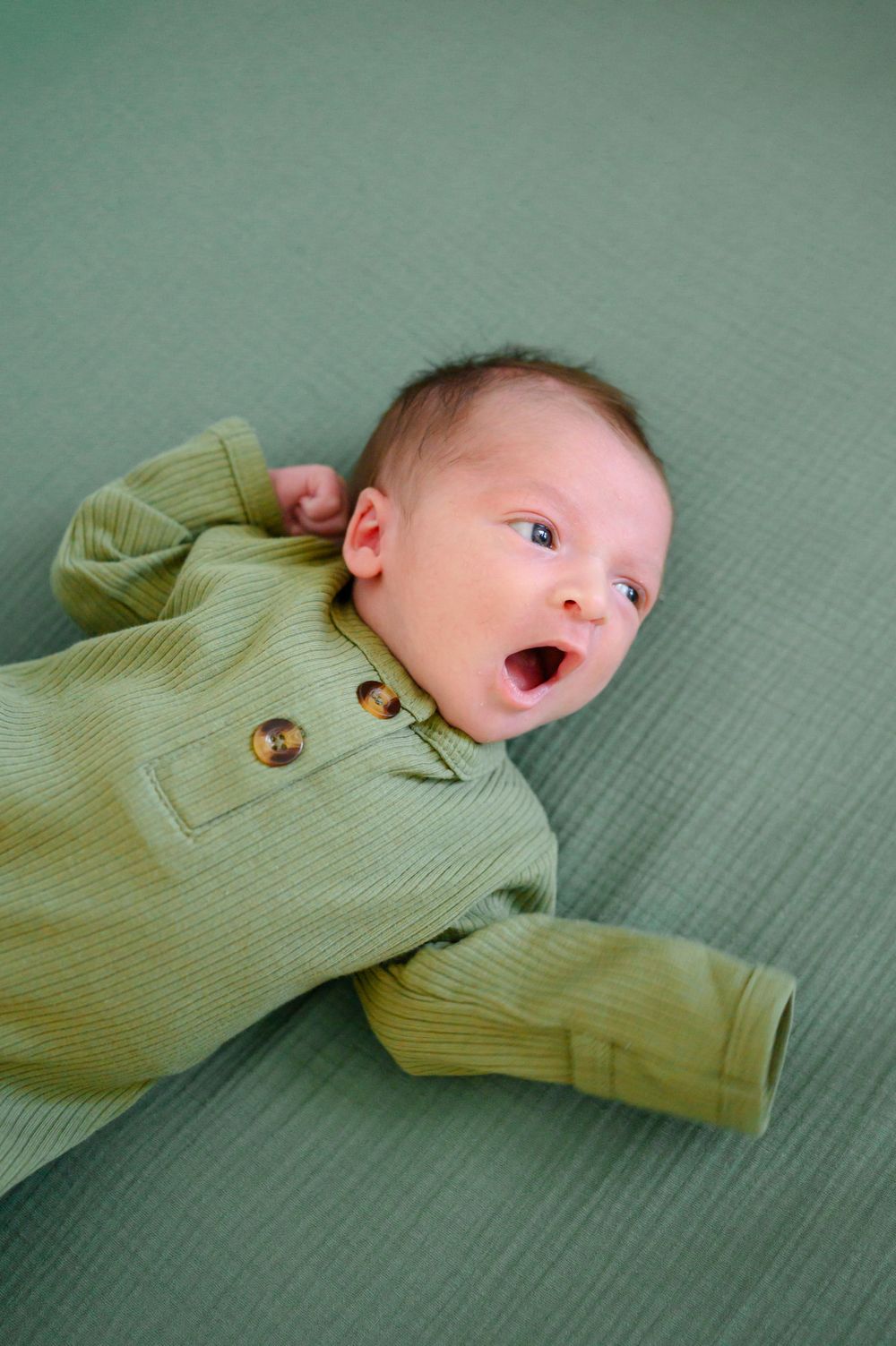 In-home newborn photography in Bedford, VA capturing authentic family moments in a relaxed environment.