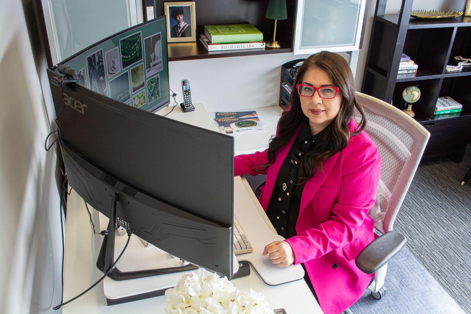 Viib Digital saint albert, st. albert, owner at desk, smiling headshot and staff photo for small business website in alberta, Paola Rohuede