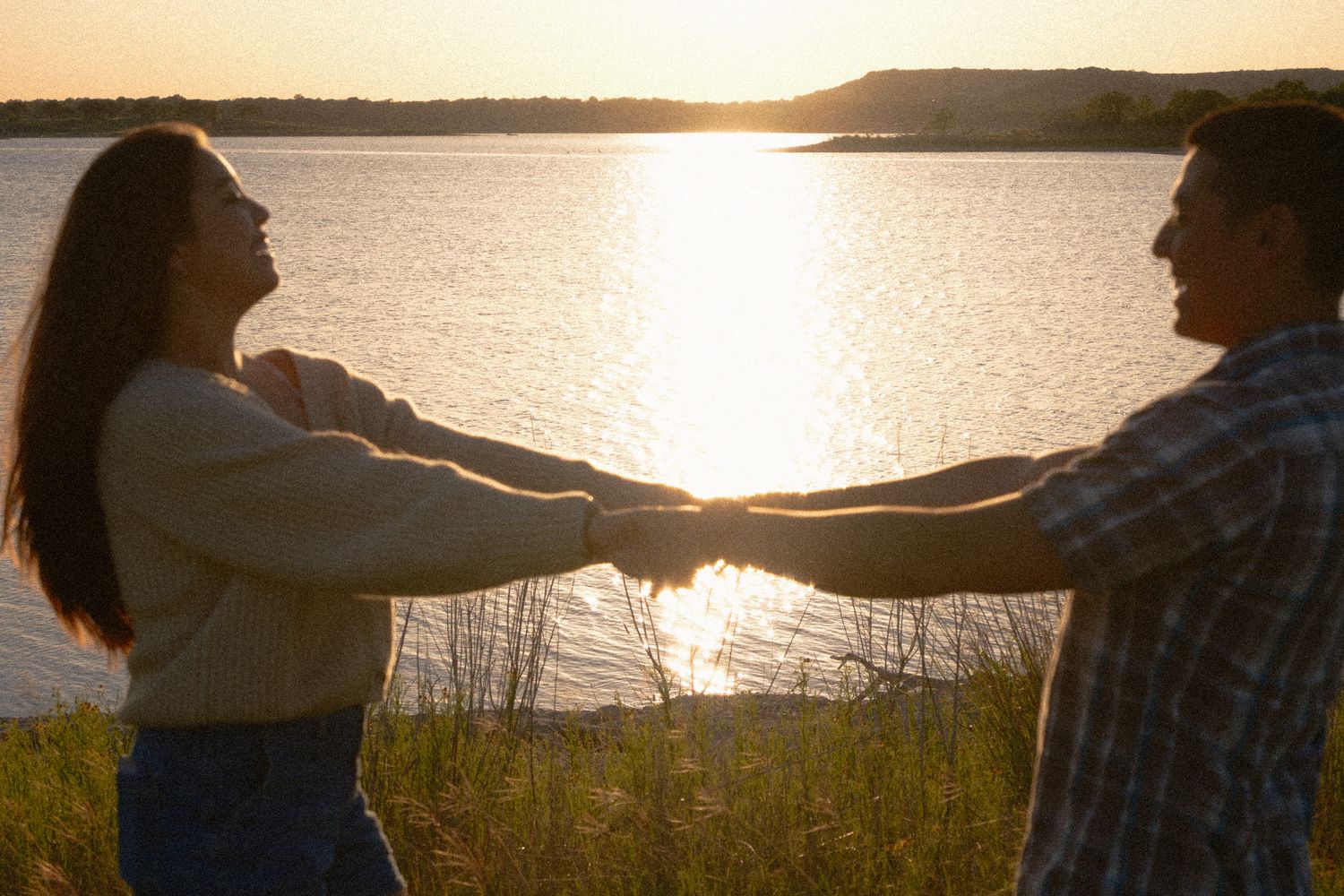 Romantic couple dancing during engagement session at Stillhouse Hollow Lake in Belton Texas