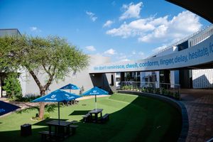Landscaped outdoor courtyard and communal space at Emeris Sandton Campus.