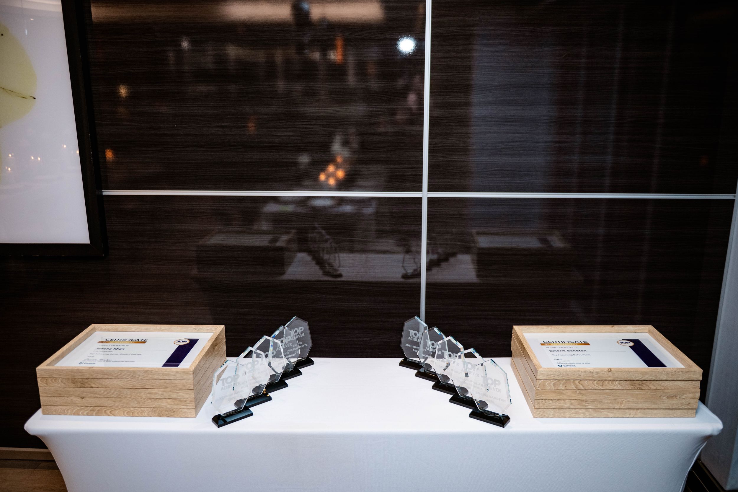 Awards and presentation boxes arranged for the Emeris Top Achiever Awards ceremony.