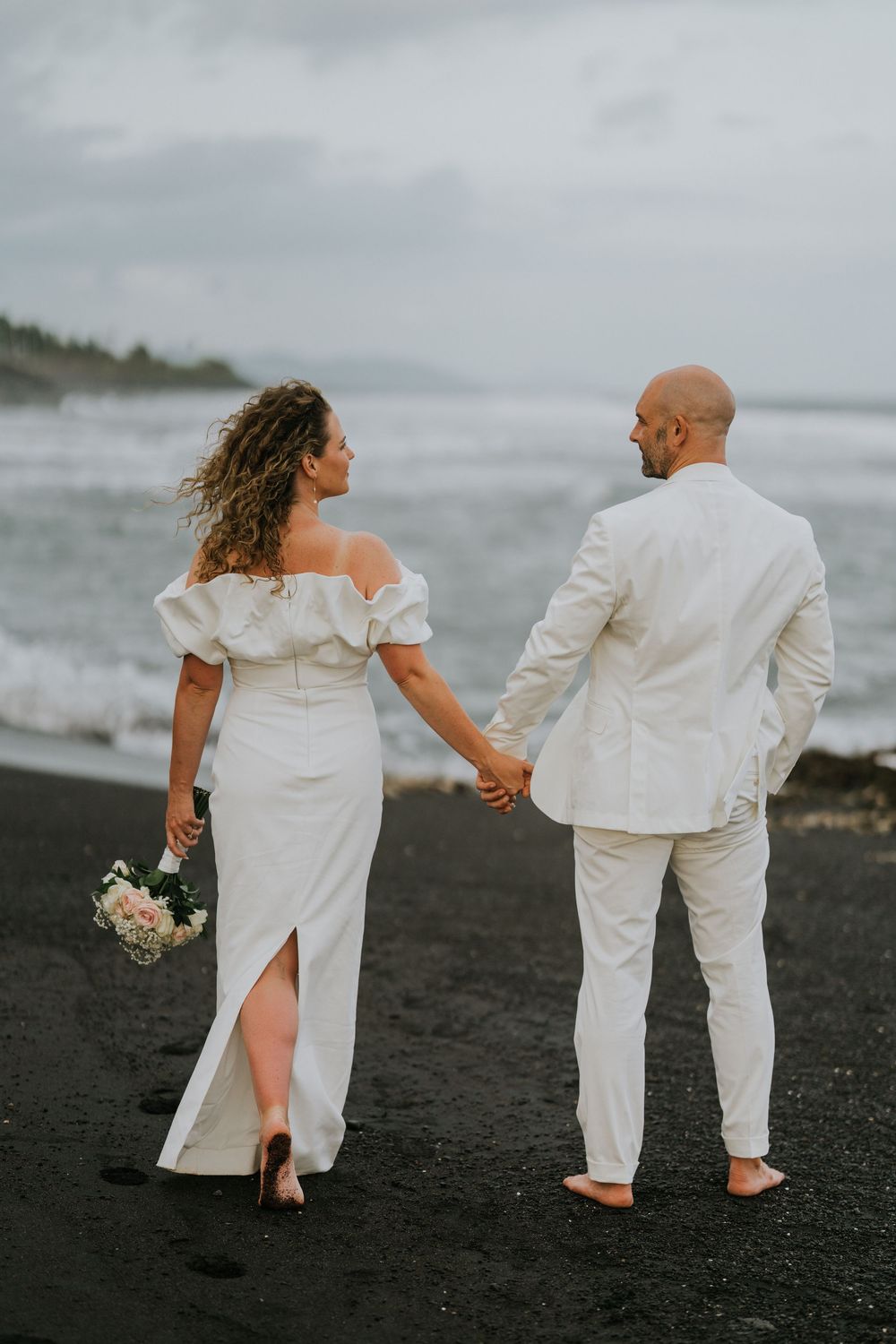 Romantic wedding portraits at The Royal Purnama beachfront resort in Bali.