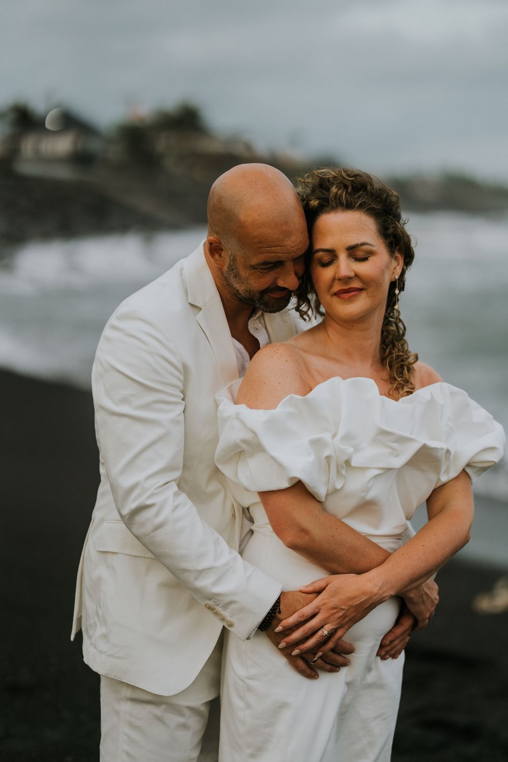 Romantic wedding portraits at The Royal Purnama beachfront resort in Bali.
