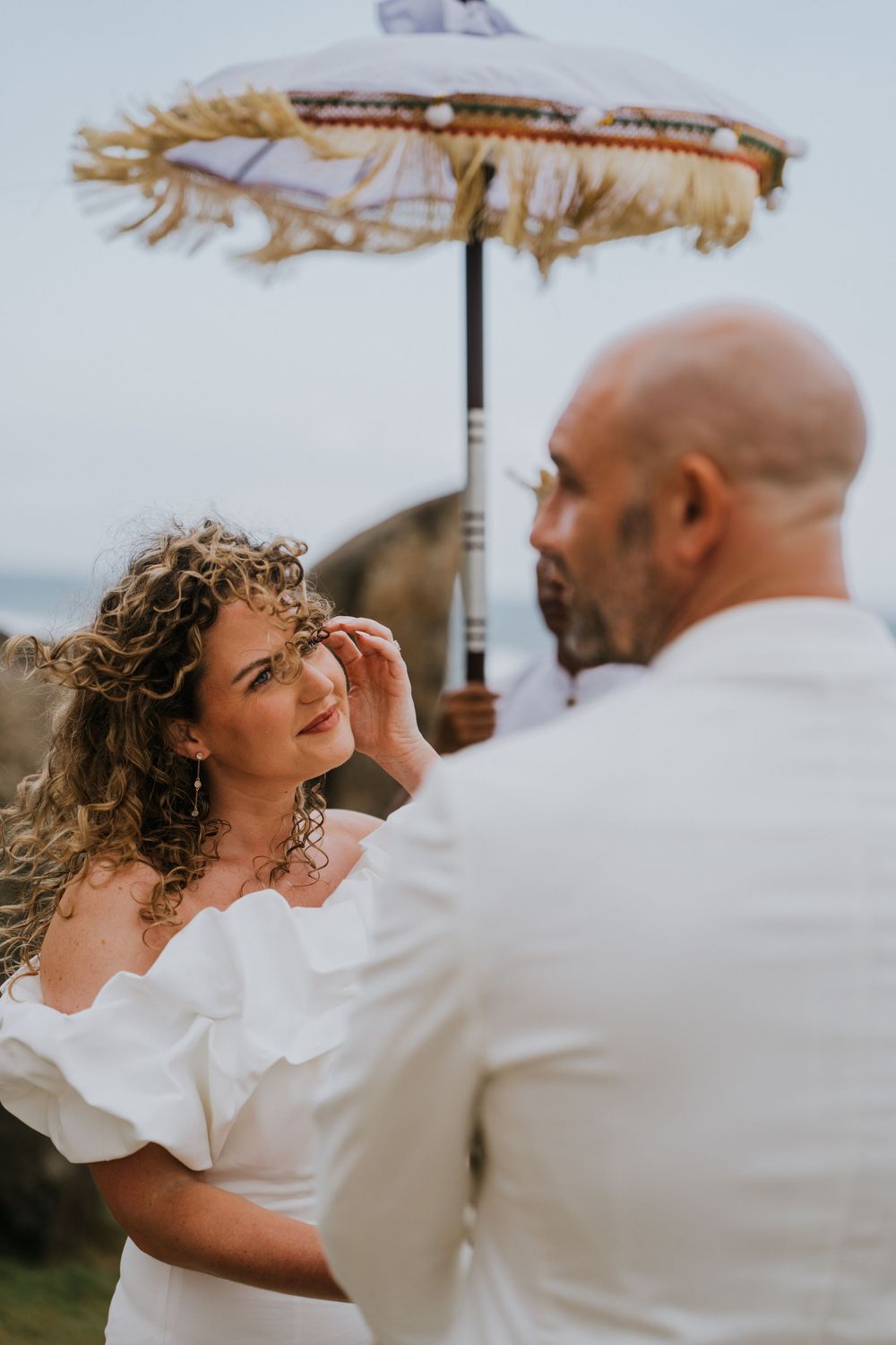 Romantic wedding portraits at The Royal Purnama beachfront resort in Bali.