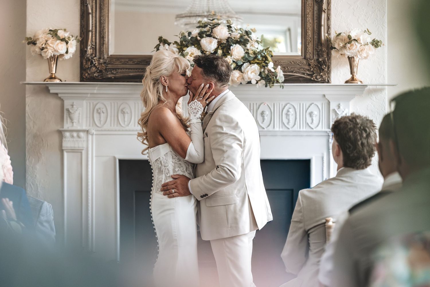 Bride and Groom first kiss in Barney Halls indoor ceremony room.