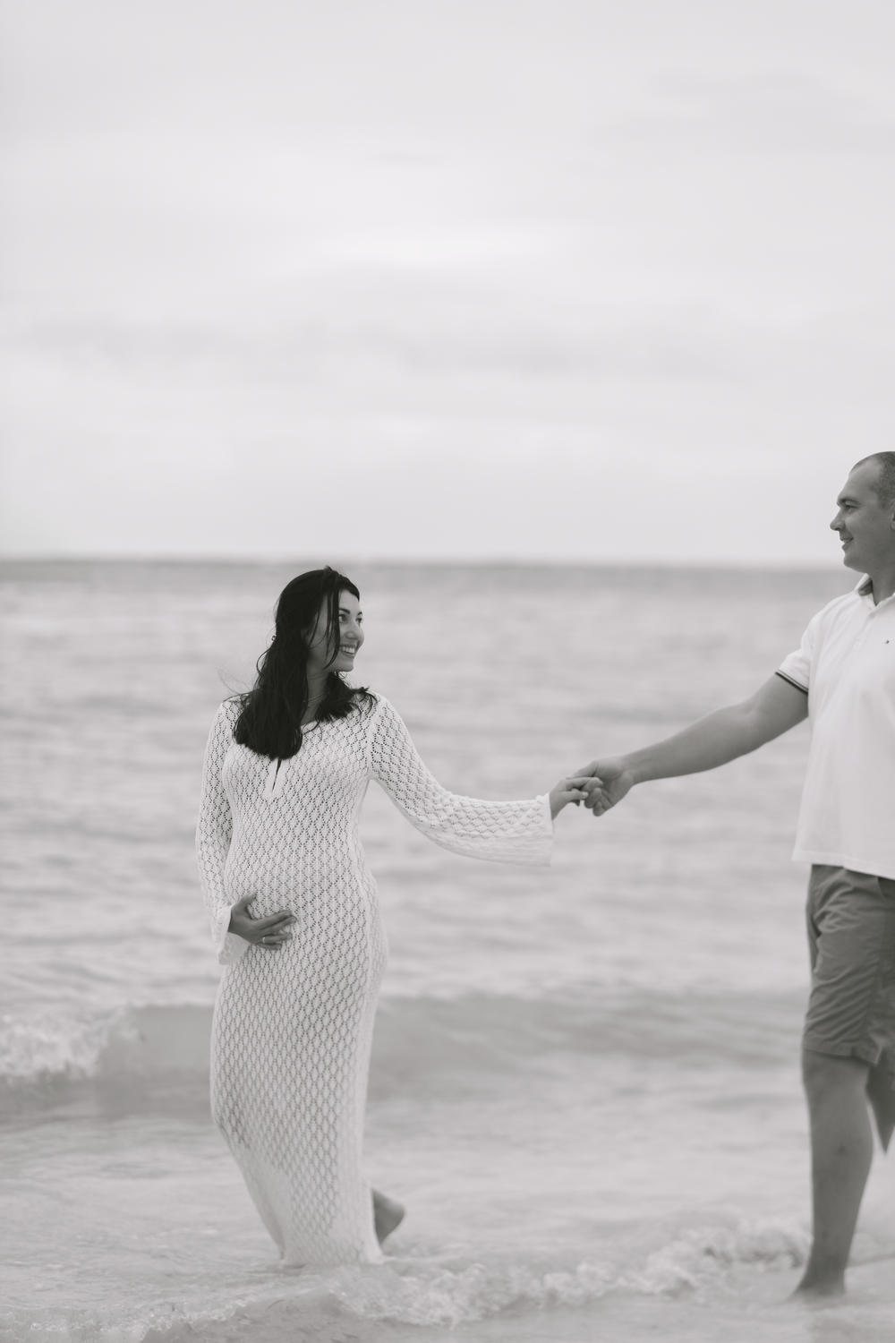 Maternity photography in Punta Cana celebrating the beauty of pregnancy by the Caribbean Sea.