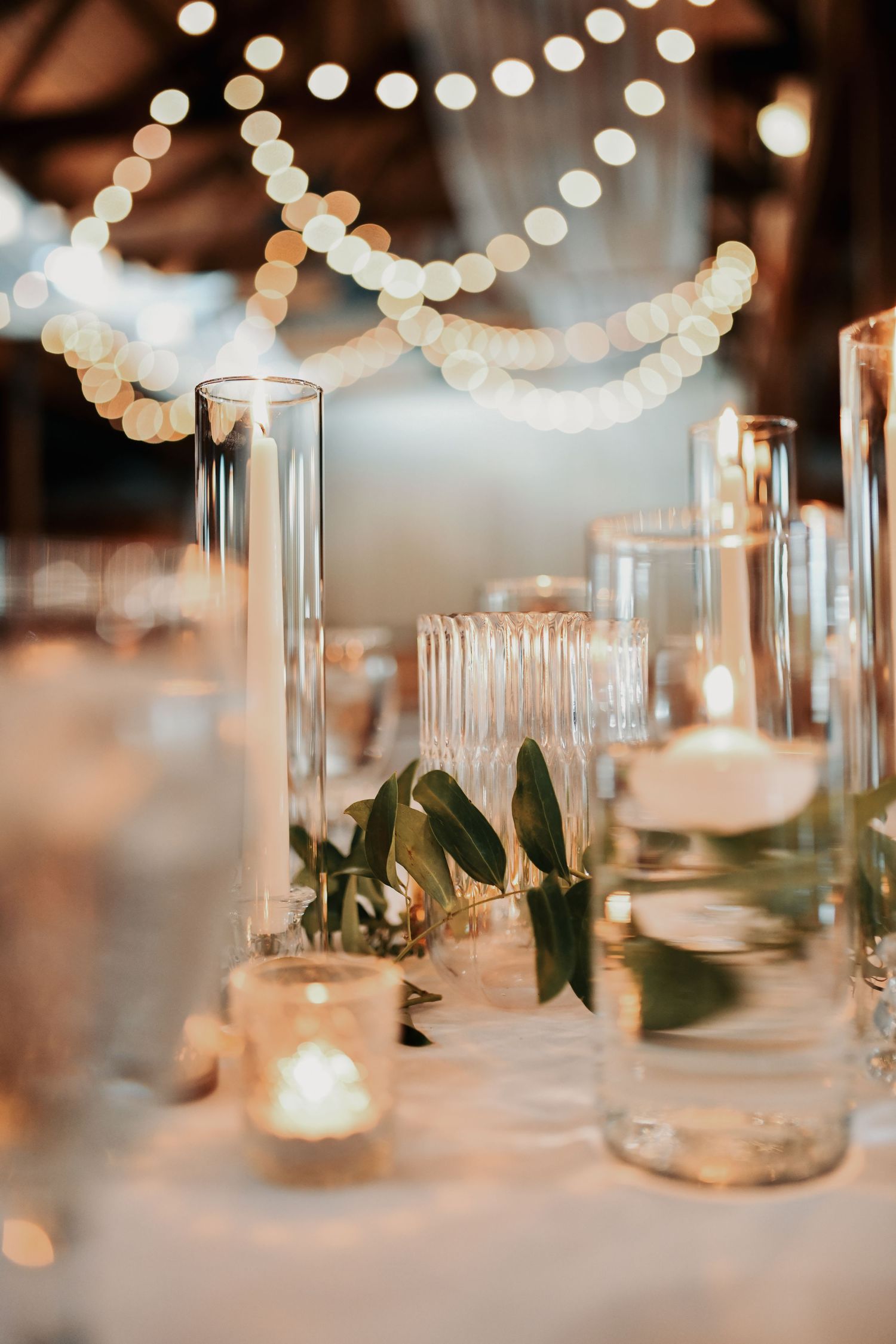 Gold accents and greenery decorating a Lucky Spur Ranch wedding reception