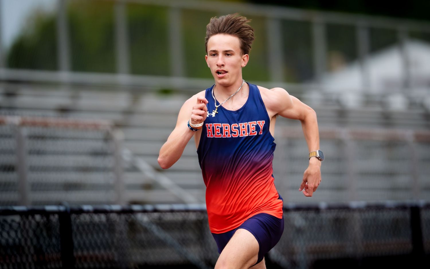 Hershey Trojans athlete racing vs. Cedar Cliff, by Deanna Fox, SportsFox Photography, Hershey PA