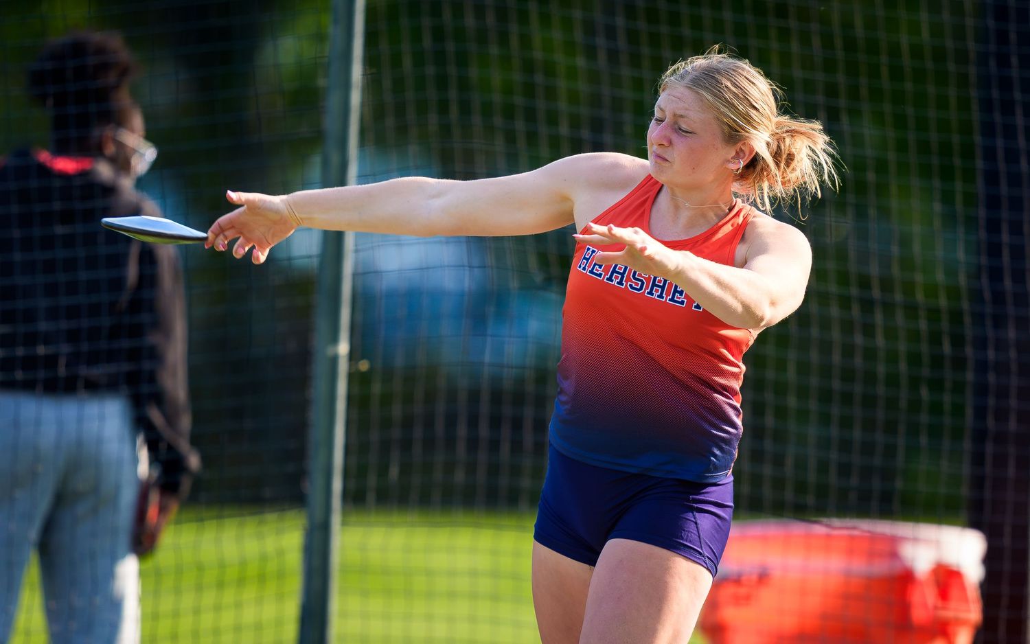 Hershey Trojans athlete throwing discus vs. Susquehanna Township, by Deanna Fox, SportsFox Photography, Hershey PA