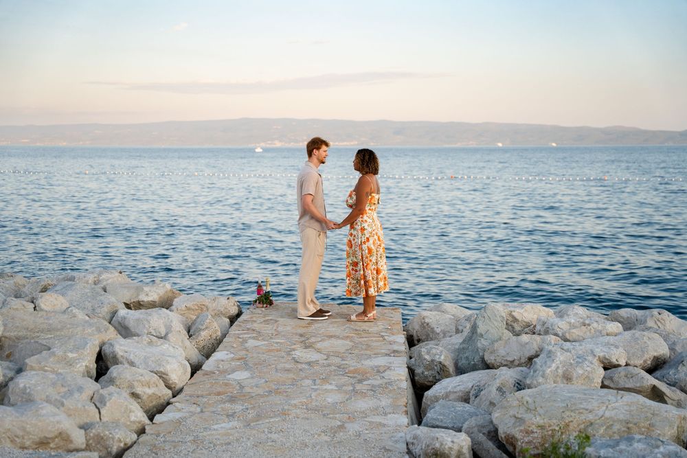 Beach surprise proposal at Žnjan Beach, Split, Croatia captured by Split proposal photographers during a romantic sunset engagement.