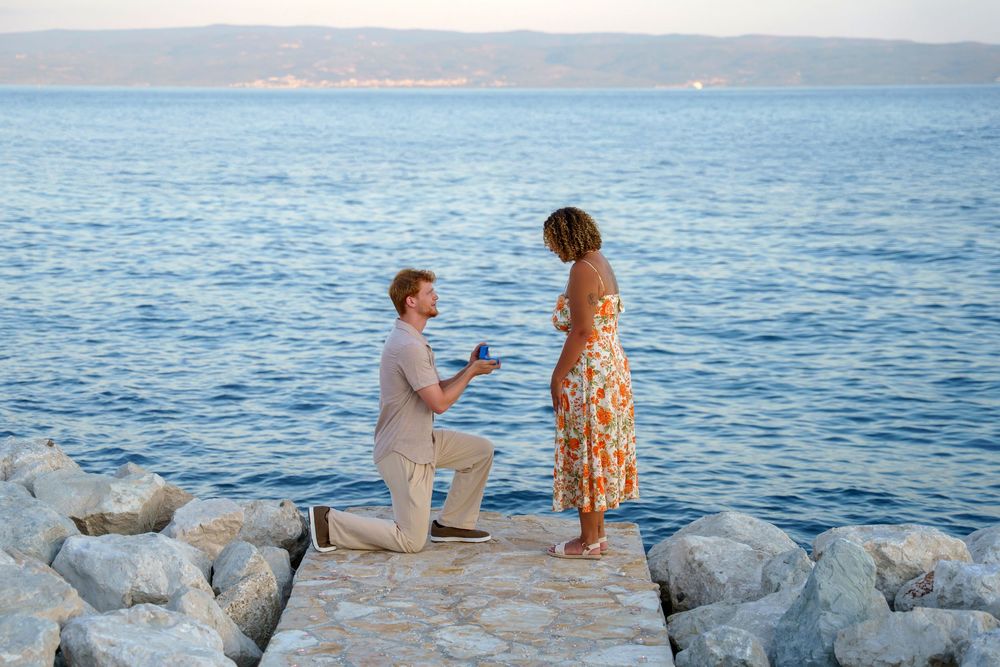 Beach surprise proposal at Žnjan Beach, Split, Croatia captured by Split proposal photographers during a romantic sunset engagement.