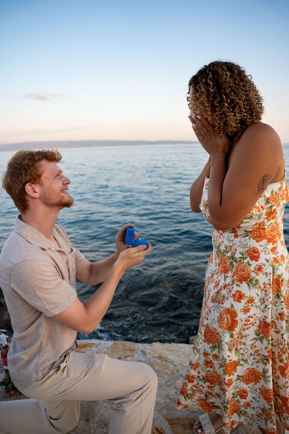 Beach surprise proposal at Žnjan Beach, Split, Croatia captured by Split proposal photographers during a romantic sunset engagement.