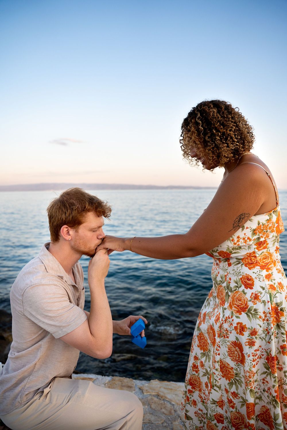Beach surprise proposal at Žnjan Beach, Split, Croatia captured by Split proposal photographers during a romantic sunset engagement.