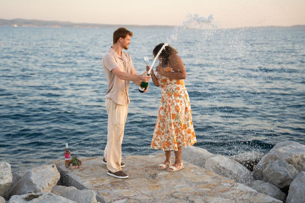 Beach surprise proposal at Žnjan Beach, Split, Croatia captured by Split proposal photographers during a romantic sunset engagement.