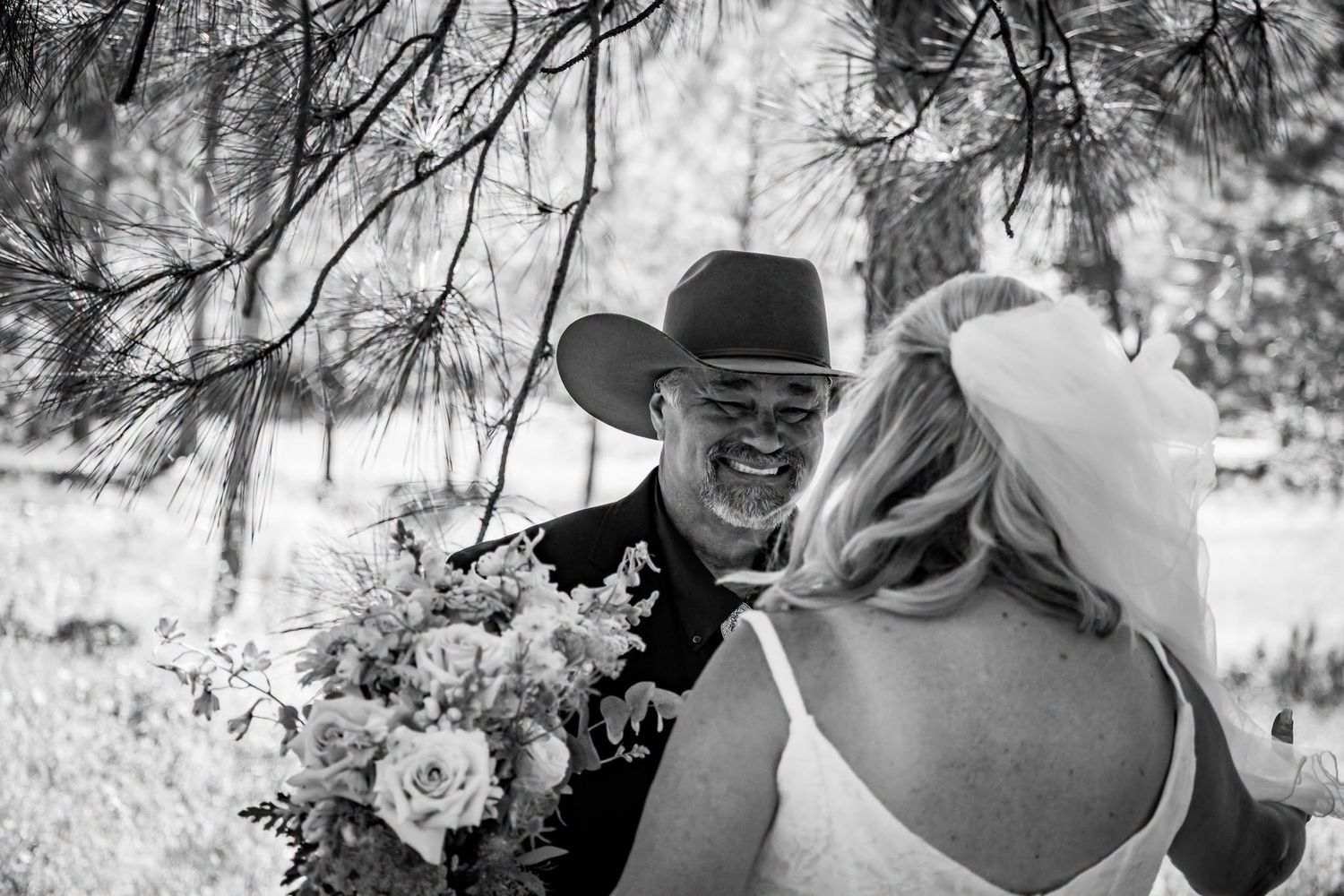 Grooms first look photo at a backyard country wedding coordinated by Hometown Wedding Co.