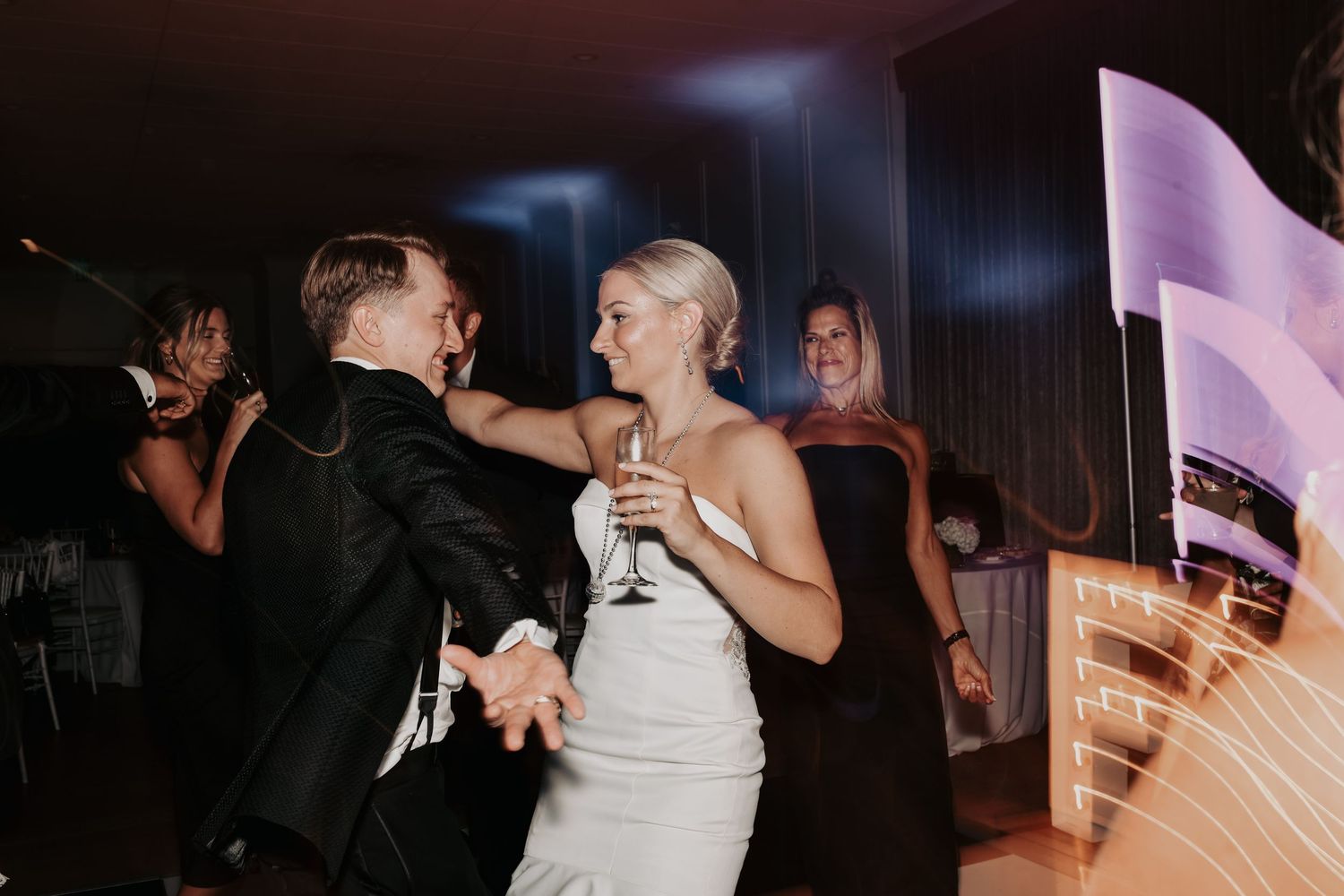 Groom dancing with friends during his Dallas wedding reception