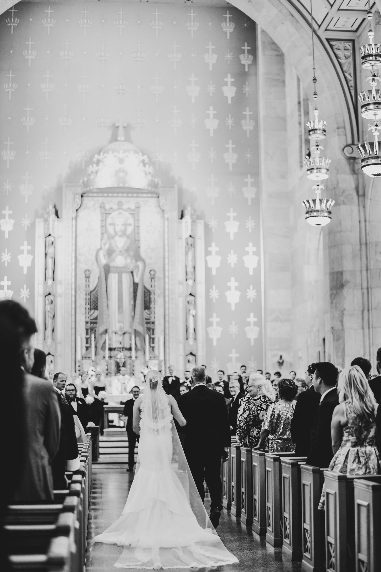 Bride walking toward Payton at Christ the King Catholic Church