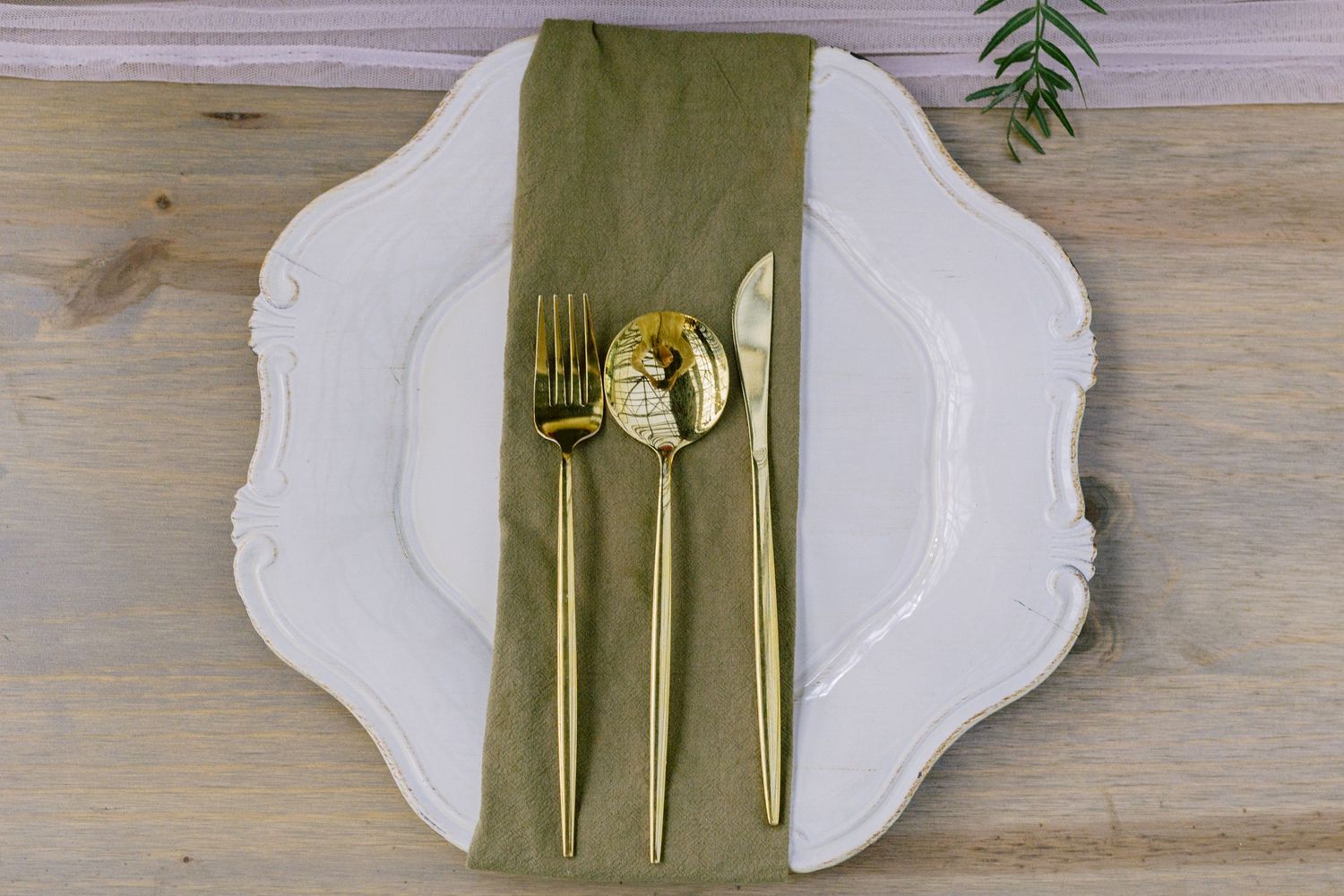 Wedding table layout photographed inside a beautifully styled venue.
