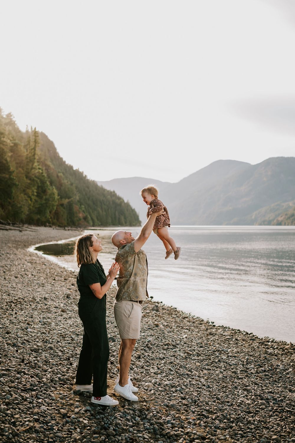 Comox Valley Photographer Portraits at Comox Lake in Cumberland, Vancouver Island. Family throwing kid in air