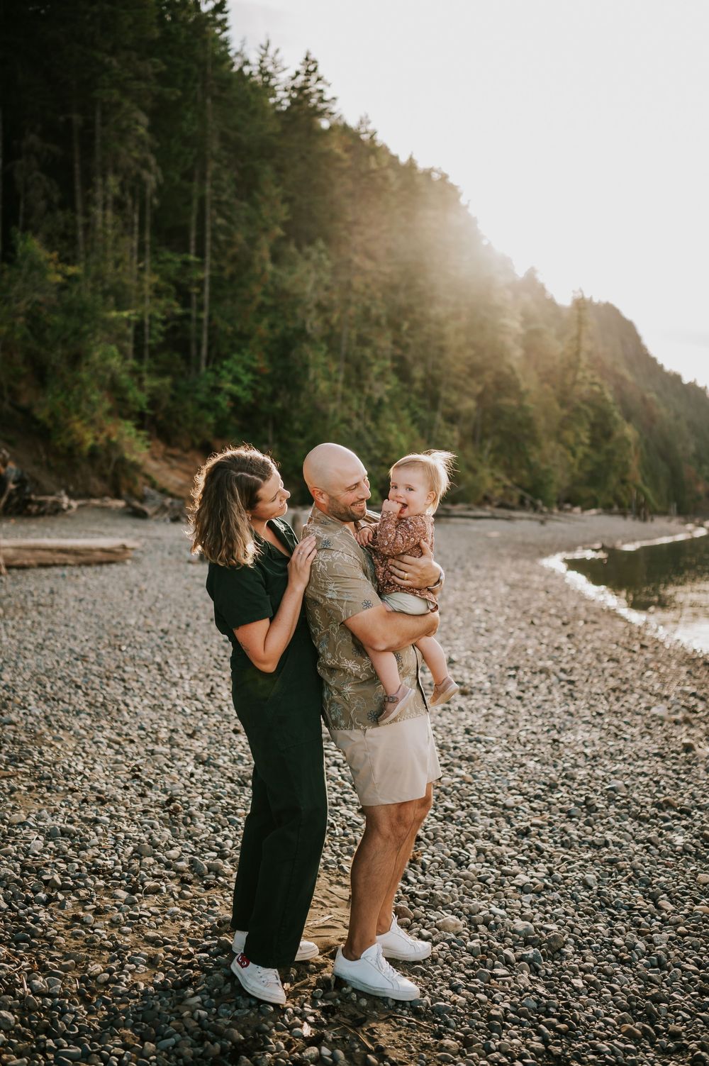 Comox Valley Photographer Portraits at Comox Lake in Cumberland, Vancouver Island. Family holding baby