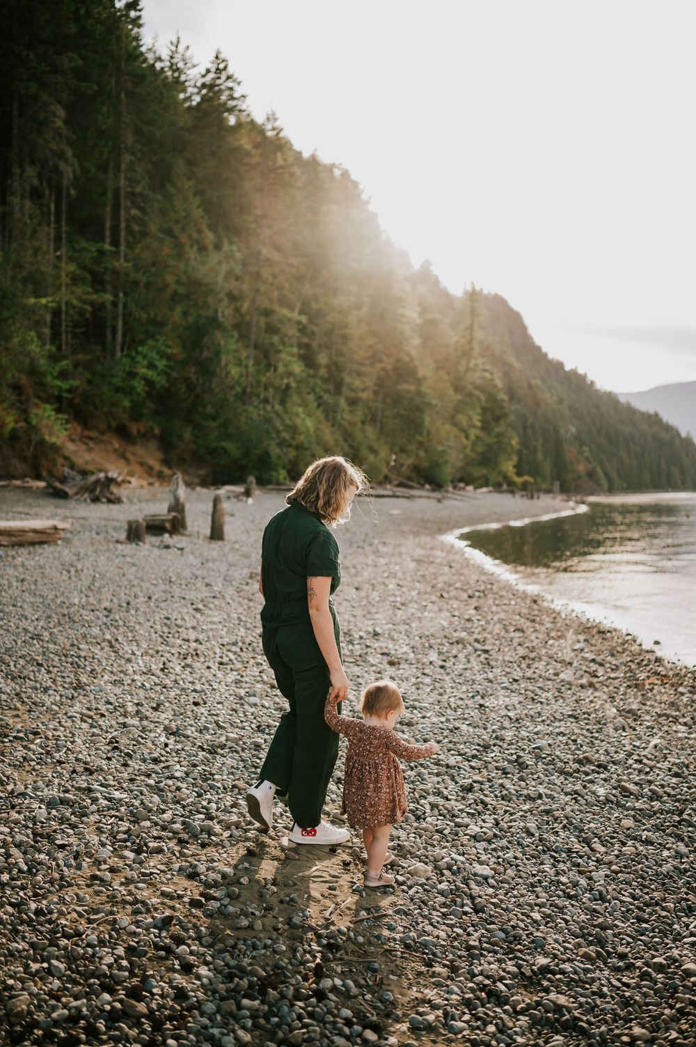 Comox Valley Photographer Portraits at Comox Lake in Cumberland, Vancouver Island. Casual and candid family photos mom walking with kid