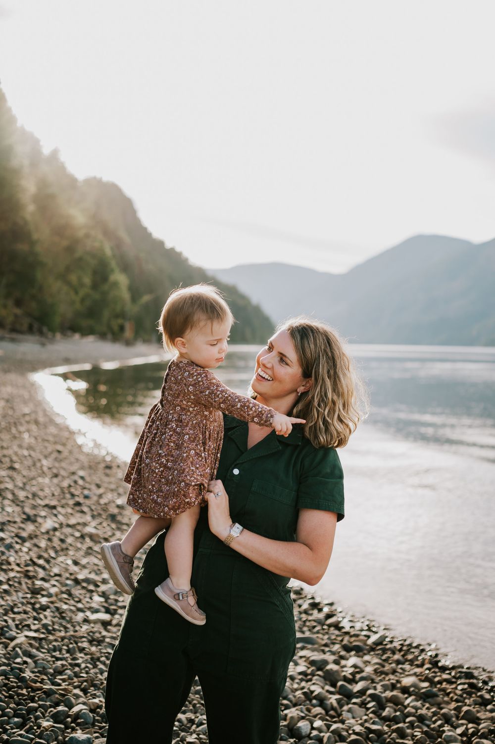 Comox Valley Photographer Portraits at Comox Lake in Cumberland, Vancouver Island. Casual and candid family photos mom holding kid