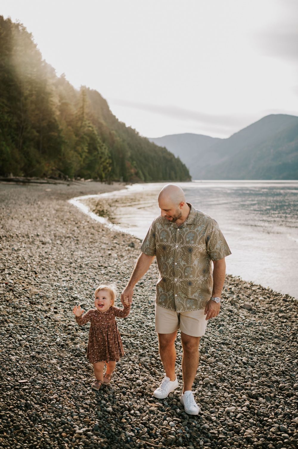Comox Valley Photographer Portraits at Comox Lake in Cumberland, Vancouver Island. Casual and candid family photos dad holding kids hand