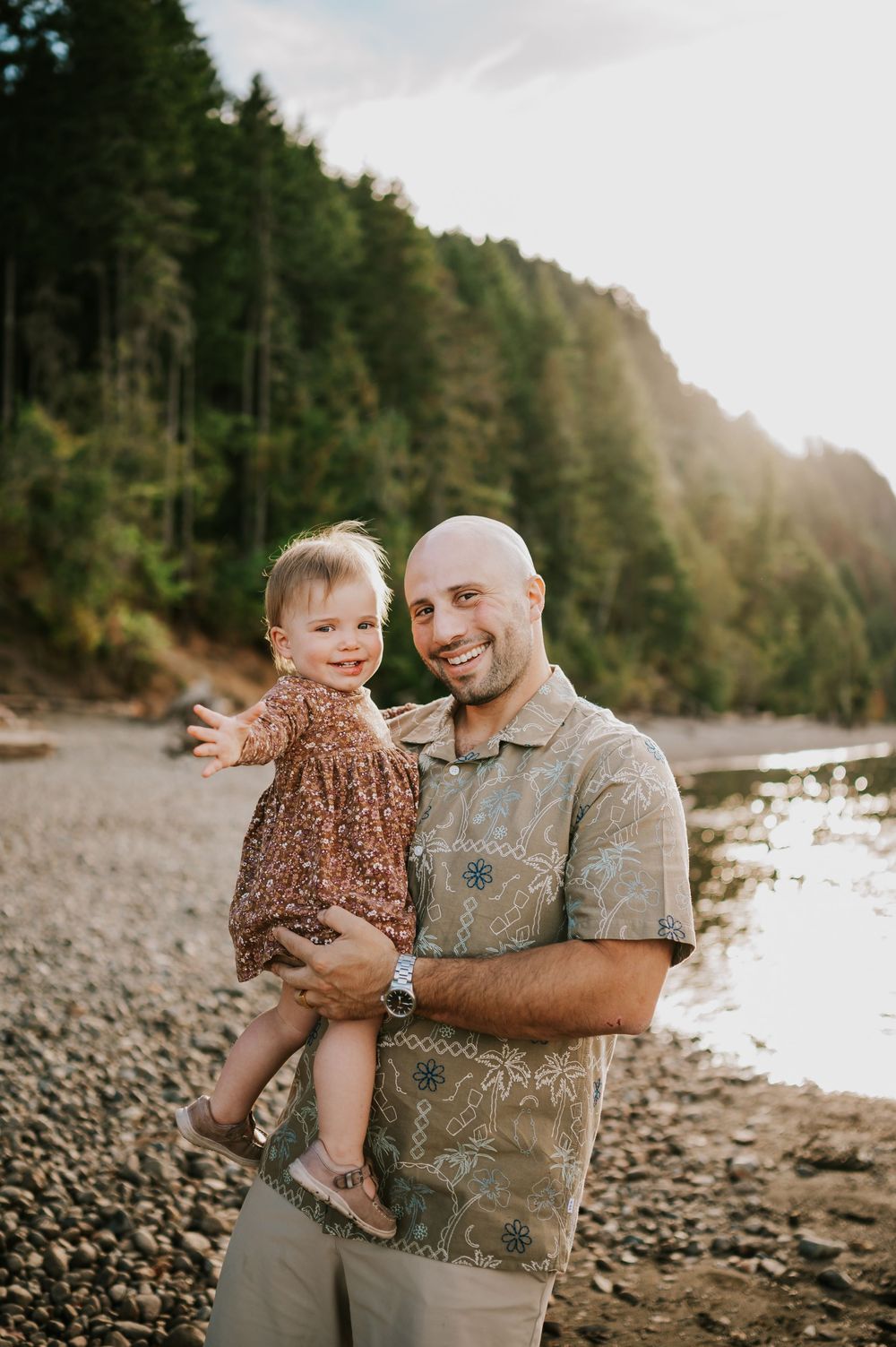Comox Valley Photographer Portraits at Comox Lake in Cumberland, Vancouver Island. Casual and candid family photos dad holding kid