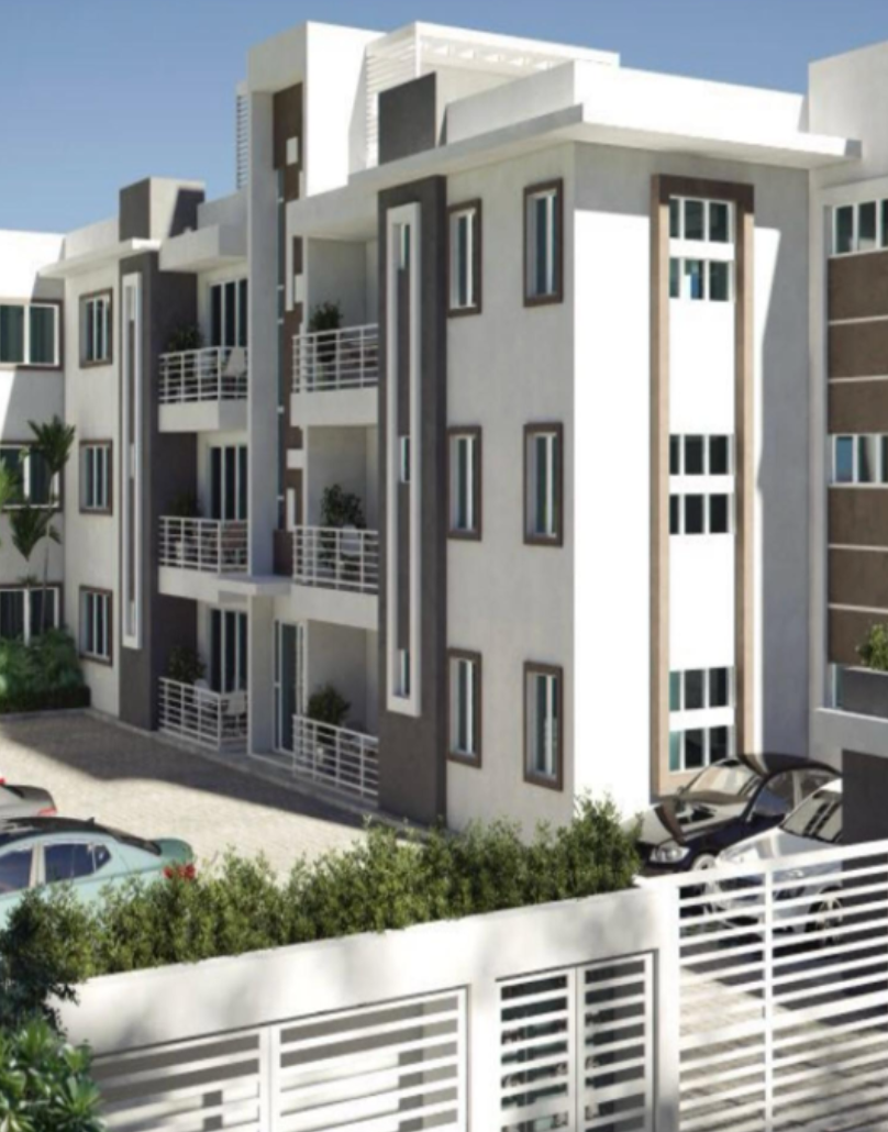 Contemporary three-story white residential apartment building with balconies, brown accents, and parking area.
