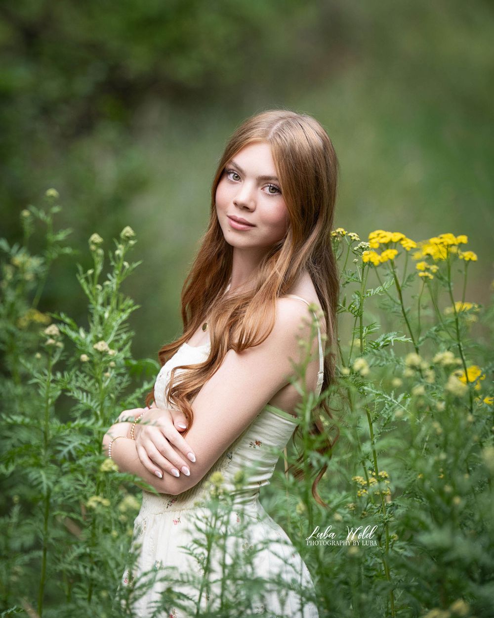 high school senior girl outdoor portrait in a flower field by photographer Luba Wold in Post Falls and Spokane