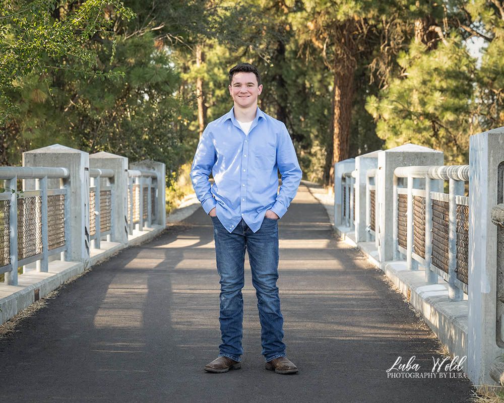 high school senior boy outdoor portrait on a bridge in Spokane by  Post Falls photographer Luba Wold