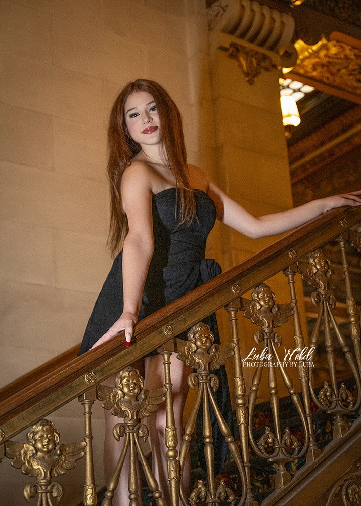 portrait of a Senior girl in Spokane Davenport Hotel on beautiful staircase by photographer Luba Wold