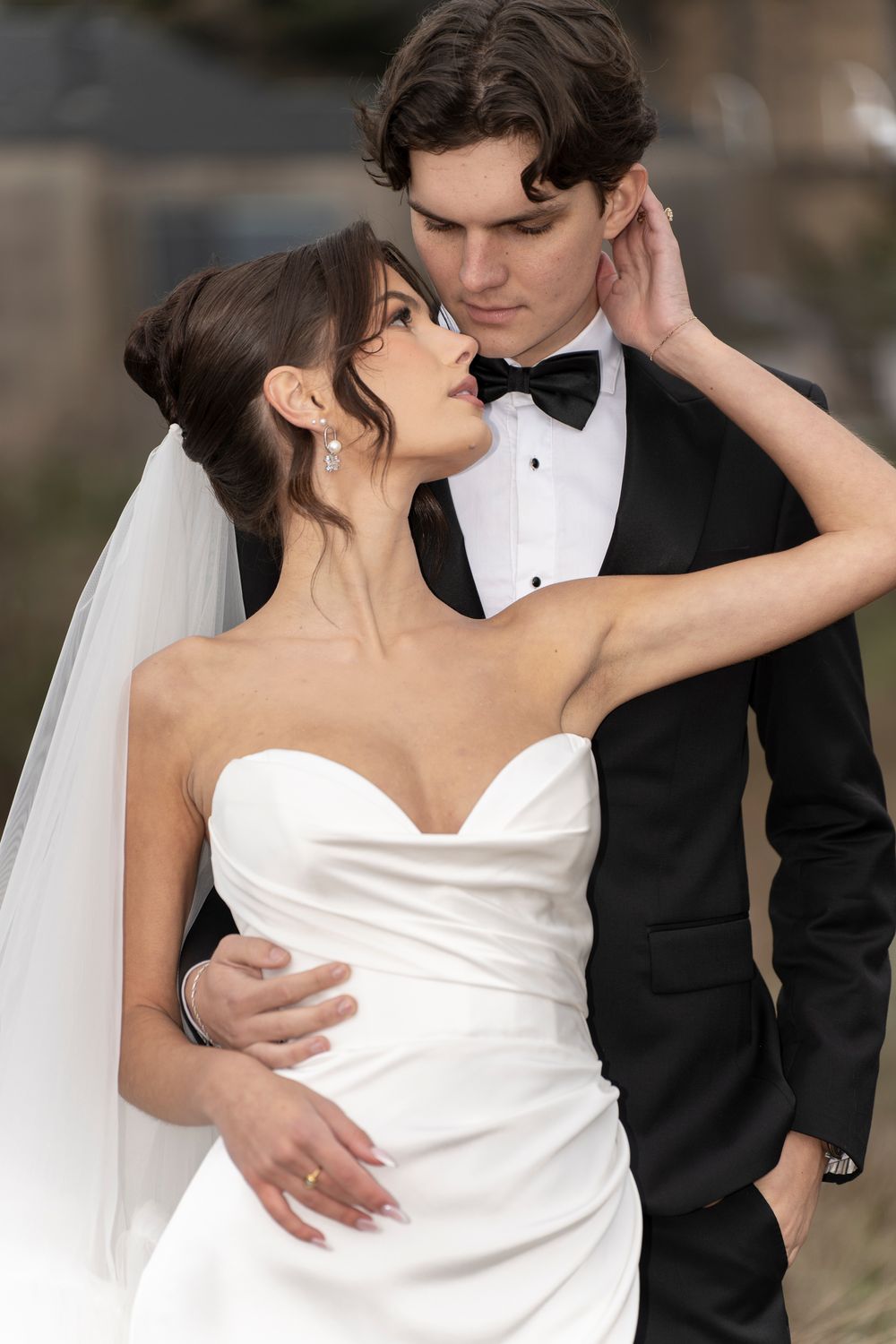 A romantic wedding photo sequence showing a couple in formal attire sharing intimate moments and embraces.