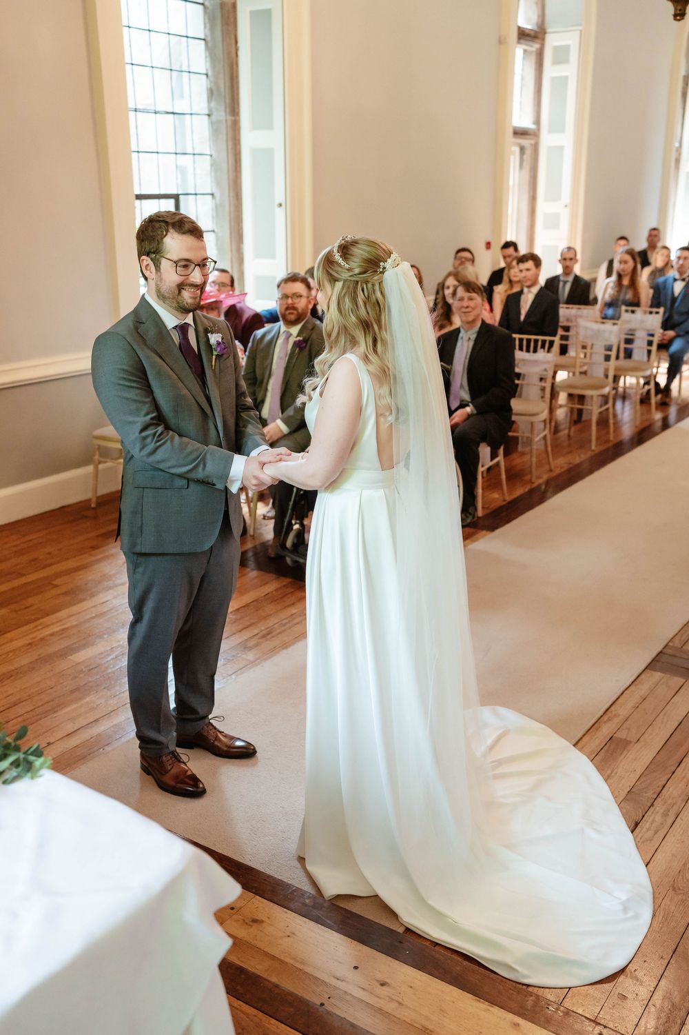 Clearwell Castle wedding venue Gloucestershire castle bride and groom exchanging vows