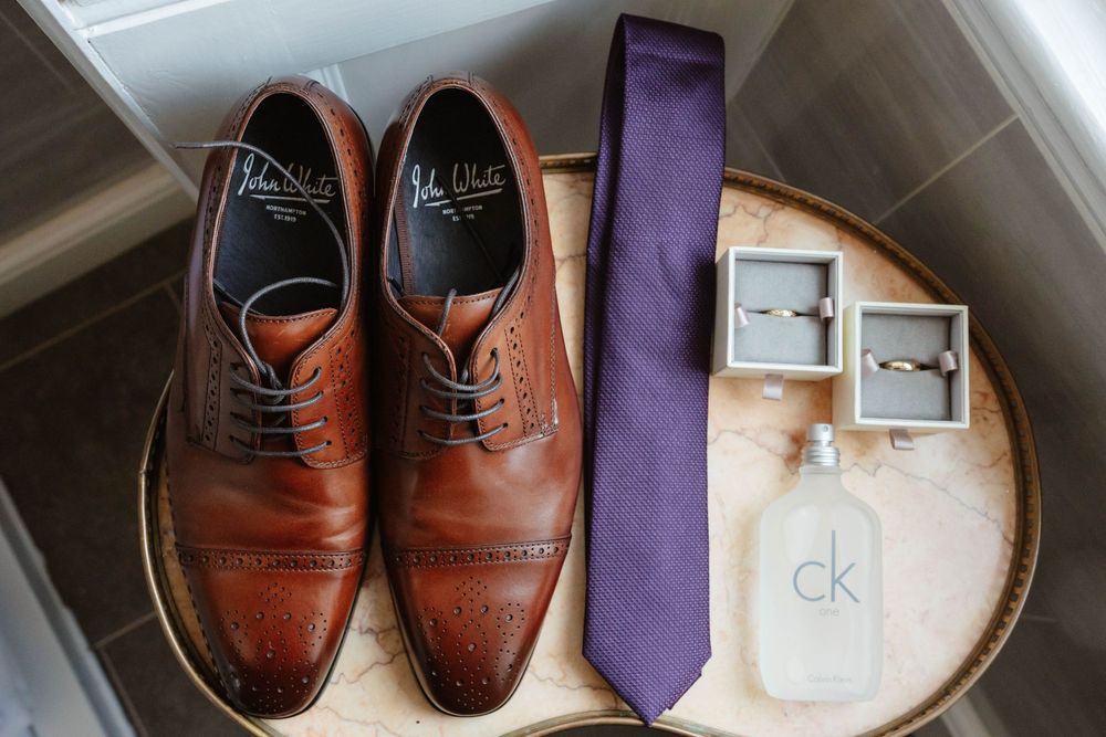 Clearwell Castle wedding venue Gloucestershire castle groom flatlay