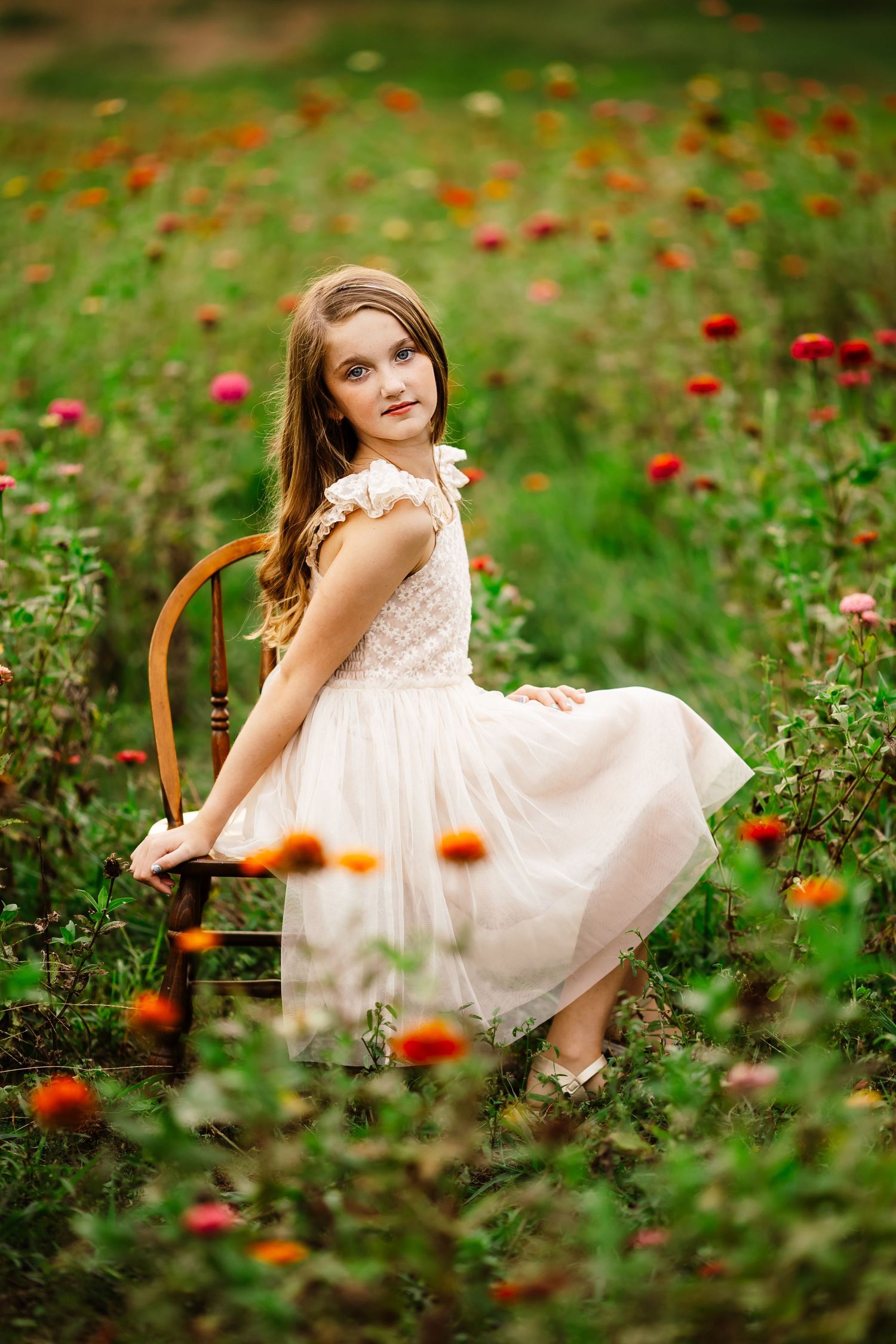 A girl in a dreamy outdoor blooming wildflower. Arkansas Photographer